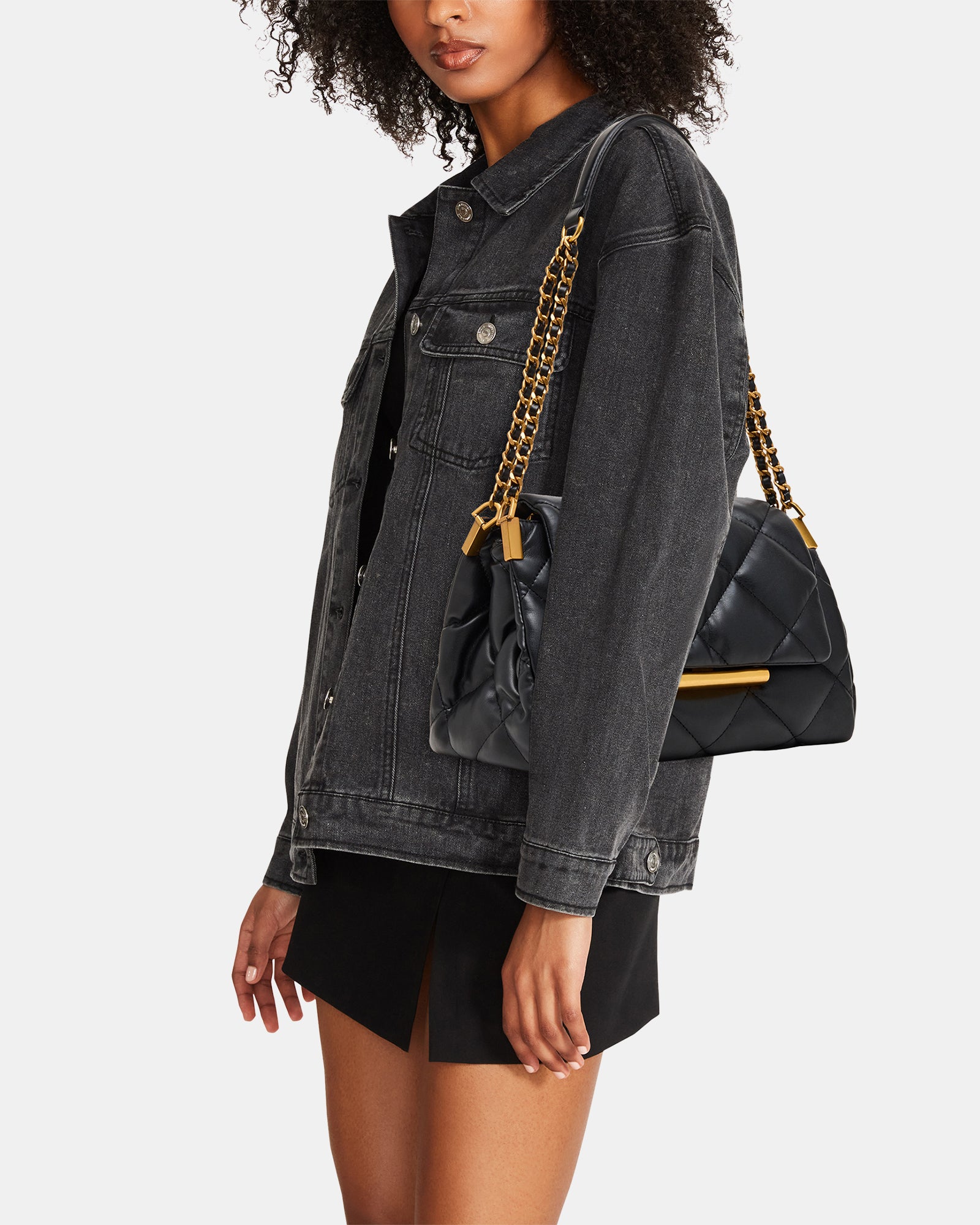 STEVEMADDEN_HANDBAGS_BCOLETTE_BLACK-GOLD_02_MODEL_f5be5cf4-ce3d-4f6a-bfcf-aa4b51de75a2.jpg